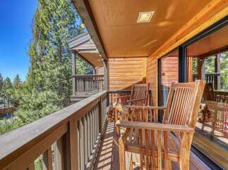 Enjoy breathtaking mountain views from this charming wooden balcony, perfect for morning coffee or evening relaxation.