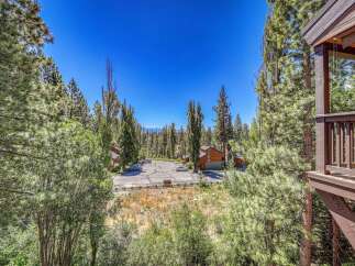 Nestled amidst a lush pine forest, this property offers a serene mountain retreat.