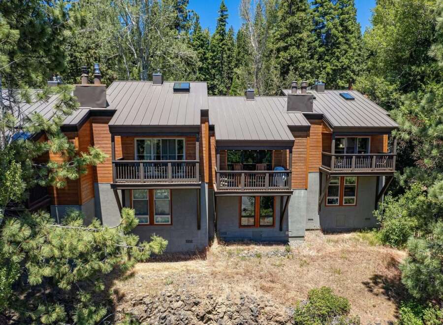 Experience modern mountain living in this stunning multi-level home, nestled amongst towering pine trees.