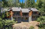 Experience modern mountain living in this stunning multi-level home, nestled amongst towering pine trees.