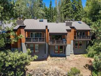 Experience modern mountain living in this stunning multi-level home, nestled amongst towering pine trees.