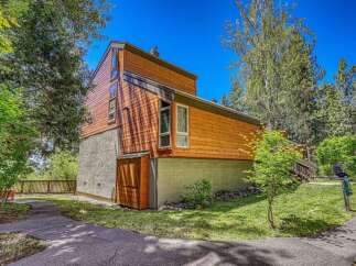 Discover modern living in this stunning multi-level home, featuring a striking cedar exterior and a concrete base.