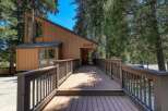 Discover this charming clubhouse, nestled amongst tall trees and accessed by a welcoming wooden deck.