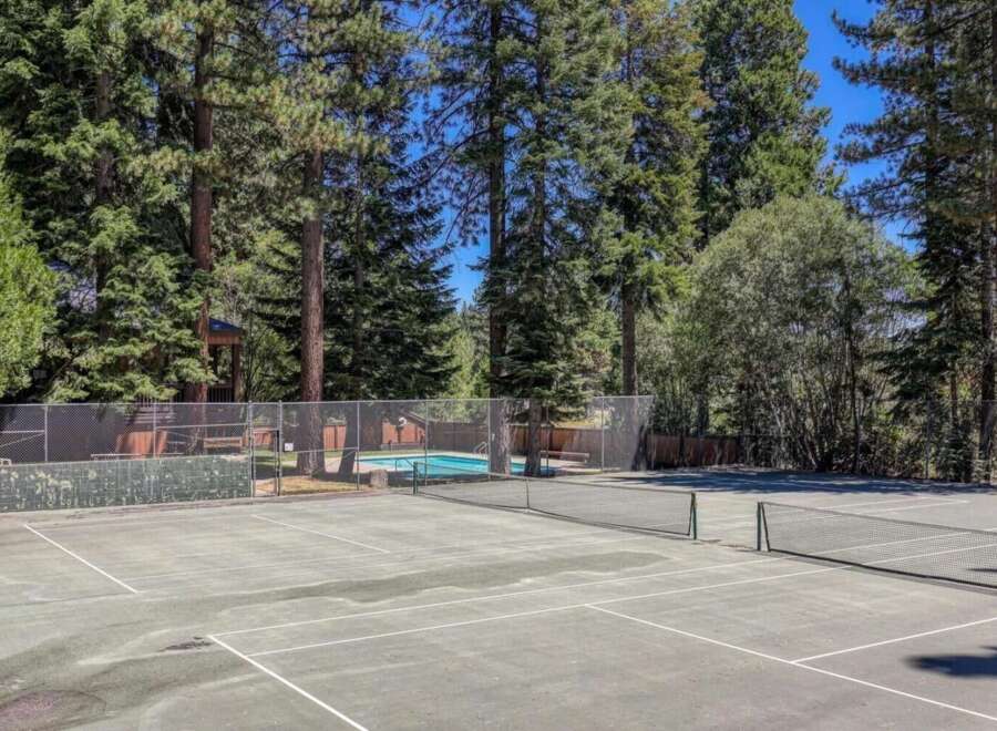 Enjoy outdoor recreation with a private tennis court and a sparkling swimming pool, perfect for active lifestyles.