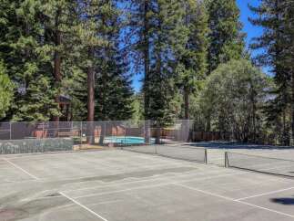 Enjoy outdoor recreation with a private tennis court and a sparkling swimming pool, perfect for active lifestyles.