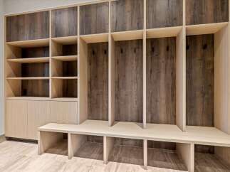 Discover this beautifully designed mudroom featuring ample storage solutions.
