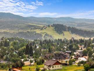 Nestled amidst lush greenery and rolling hills, this property offers a serene mountain lifestyle with stunning views of the ski jumps.