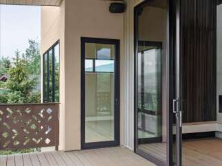 Experience seamless indoor-outdoor living with this modern deck featuring a sleek overhead heater and integrated lighting, perfect for extending your enjoyment of the scenic views.