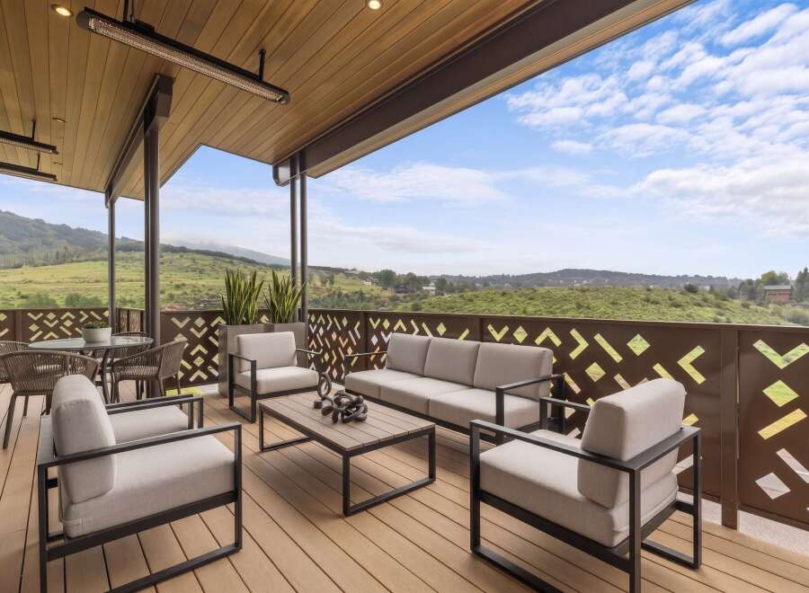 Experience breathtaking panoramic views from this expansive covered patio, perfect for entertaining or relaxing.