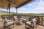 Experience breathtaking panoramic views from this expansive covered patio, perfect for entertaining or relaxing.
