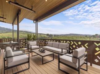 Experience breathtaking panoramic views from this expansive covered patio, perfect for entertaining or relaxing.