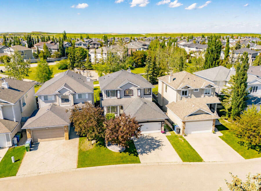 Discover this charming suburban neighborhood featuring a collection of well-maintained family homes with spacious yards and attached garages.