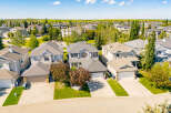 Discover this charming suburban neighborhood featuring a collection of well-maintained family homes with spacious yards and attached garages.