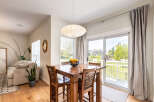Enjoy casual dining in this bright and airy space, perfect for morning coffee or intimate meals.