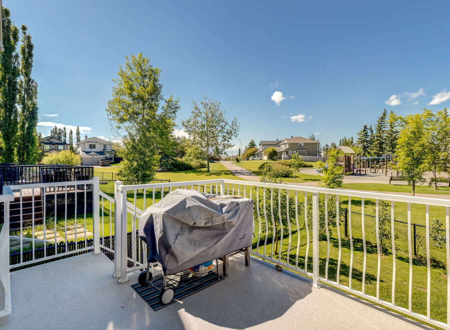 Enjoy outdoor living on this spacious deck, perfect for entertaining or relaxing with a view of the park.