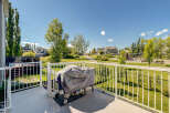 Enjoy outdoor living on this spacious deck, perfect for entertaining or relaxing with a view of the park.