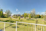 Enjoy the beautiful park-like setting from your private balcony, overlooking a vibrant green space with a playground and walking paths.