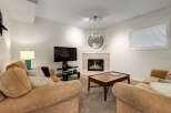 Cozy up by the modern gas fireplace in this inviting living room, perfect for relaxing evenings.