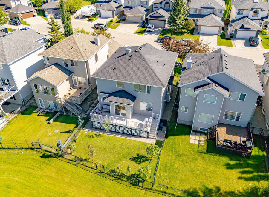 Discover this stunning property featuring a spacious backyard with a large deck, perfect for outdoor entertaining.