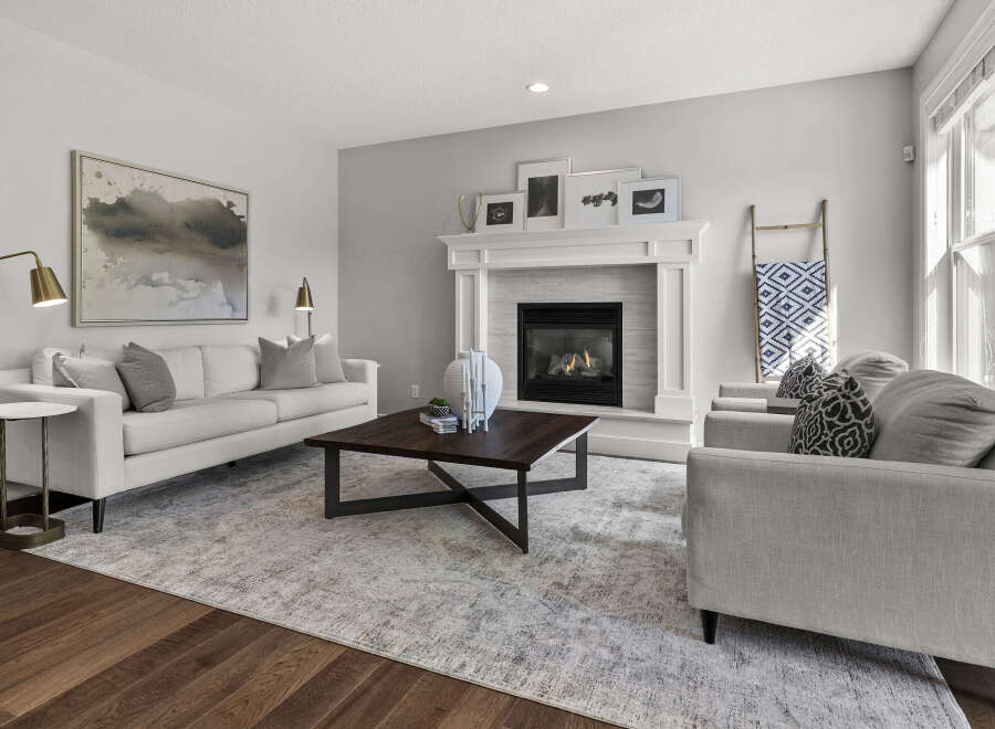 Experience modern comfort in this inviting living room, featuring a sleek fireplace as the focal point.