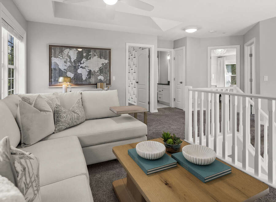 This spacious loft area offers a comfortable sectional sofa perfect for relaxing or entertaining.
