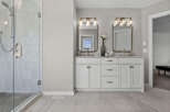Experience luxury in this stunning bathroom featuring a spacious glass-enclosed shower with elegant tilework.