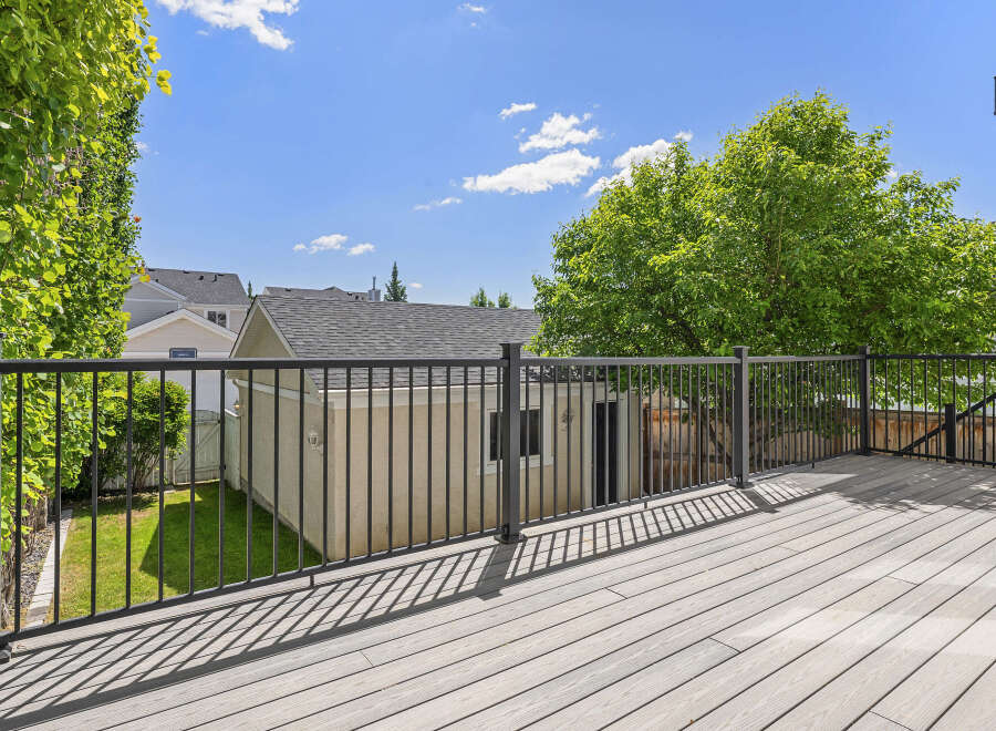 Enjoy outdoor living on this spacious deck, perfect for entertaining or relaxing.