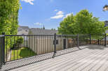 Enjoy outdoor living on this spacious deck, perfect for entertaining or relaxing.