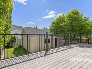 Enjoy outdoor living on this spacious deck, perfect for entertaining or relaxing.