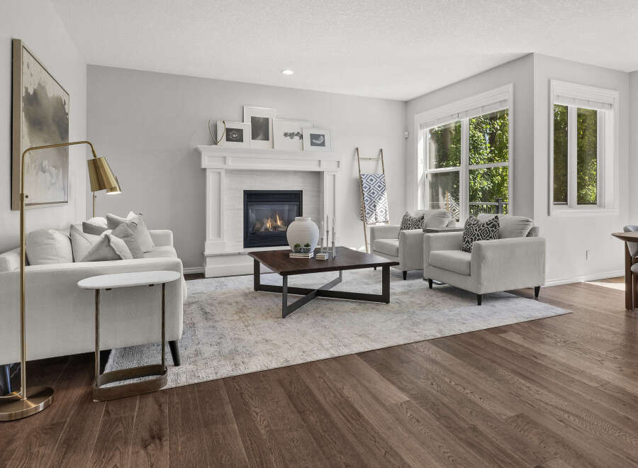 Step into this inviting living room, featuring a cozy fireplace as the centerpiece, perfect for gathering with loved ones.