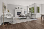 Step into this inviting living room, featuring a cozy fireplace as the centerpiece, perfect for gathering with loved ones.