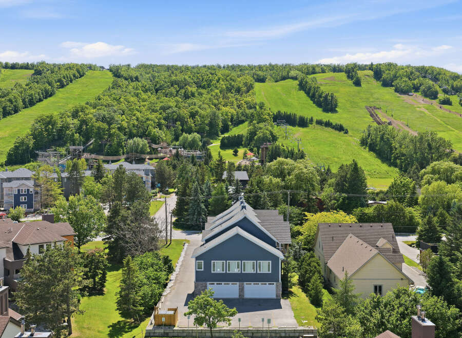 Experience the ultimate mountain lifestyle with this stunning property offering direct access to ski slopes and summer adventure parks.