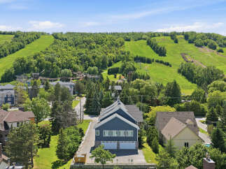 Experience the ultimate mountain lifestyle with this stunning property offering direct access to ski slopes and summer adventure parks.