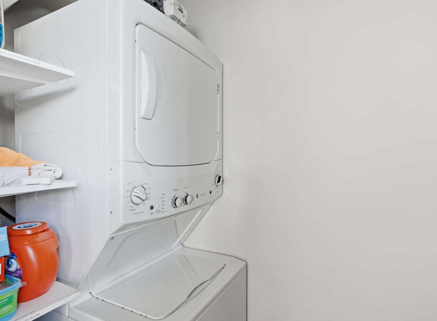 Discover the convenience of this stacked washer and dryer unit, perfect for maximizing space in your laundry area.