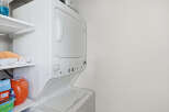 Discover the convenience of this stacked washer and dryer unit, perfect for maximizing space in your laundry area.