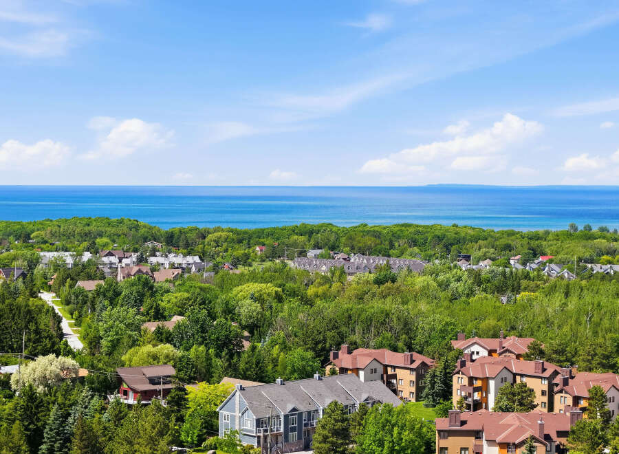 Discover this stunning property offering breathtaking views of the serene blue waters and lush green landscapes.