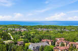 Discover this stunning property offering breathtaking views of the serene blue waters and lush green landscapes.