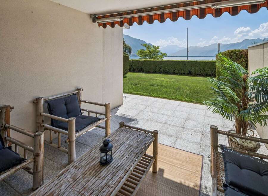 Enjoy breathtaking lake and mountain views from this charming patio, perfect for relaxing or entertaining.