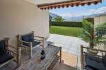 Enjoy breathtaking lake and mountain views from this charming patio, perfect for relaxing or entertaining.