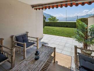 Enjoy breathtaking lake and mountain views from this charming patio, perfect for relaxing or entertaining.