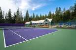 Experience luxury living with this stunning property featuring a vibrant purple tennis court, perfect for enthusiasts.