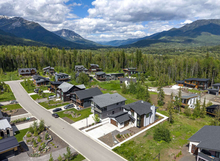 Discover modern luxury living nestled amidst breathtaking mountain scenery.