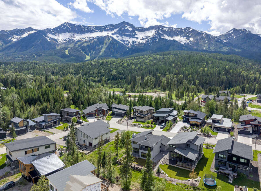 Experience modern mountain living in this stunning new construction home, nestled amidst a lush forest with breathtaking mountain views.