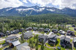 Experience modern mountain living in this stunning new construction home, nestled amidst a lush forest with breathtaking mountain views.