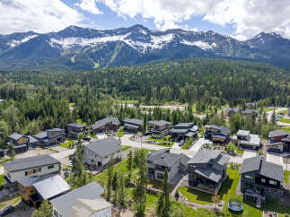 Experience modern mountain living in this stunning new construction home, nestled amidst a lush forest with breathtaking mountain views.