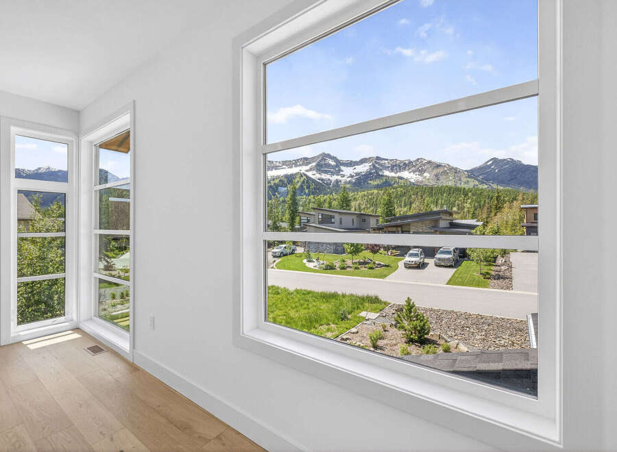 Experience breathtaking mountain views from this stunning property, framed by expansive windows that bring the outdoors in.