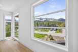 Experience breathtaking mountain views from this stunning property, framed by expansive windows that bring the outdoors in.
