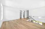 Experience modern living in this spacious, open-concept home featuring gleaming hardwood floors throughout.
