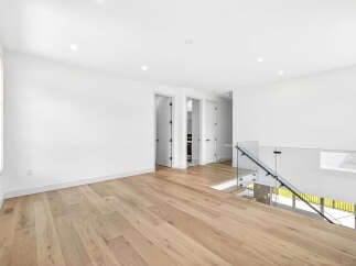 Experience modern living in this spacious, open-concept home featuring gleaming hardwood floors throughout.