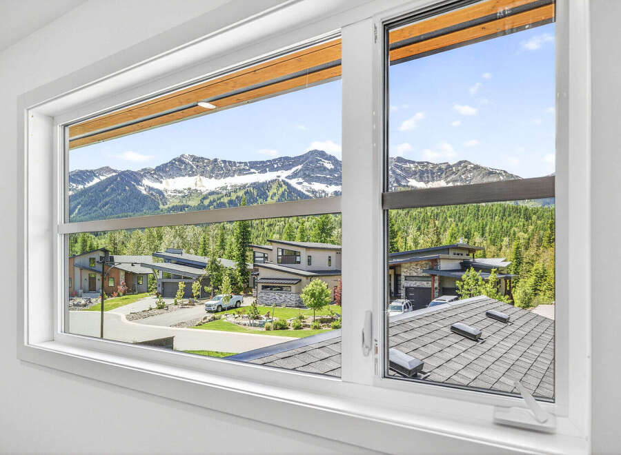 Experience breathtaking mountain views from this stunning modern home.